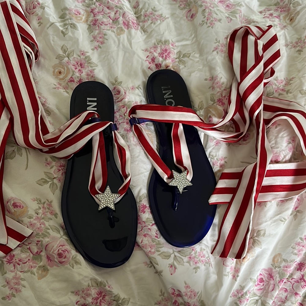 Gently worn red white and blue ribbon ankle wrap sandals.
